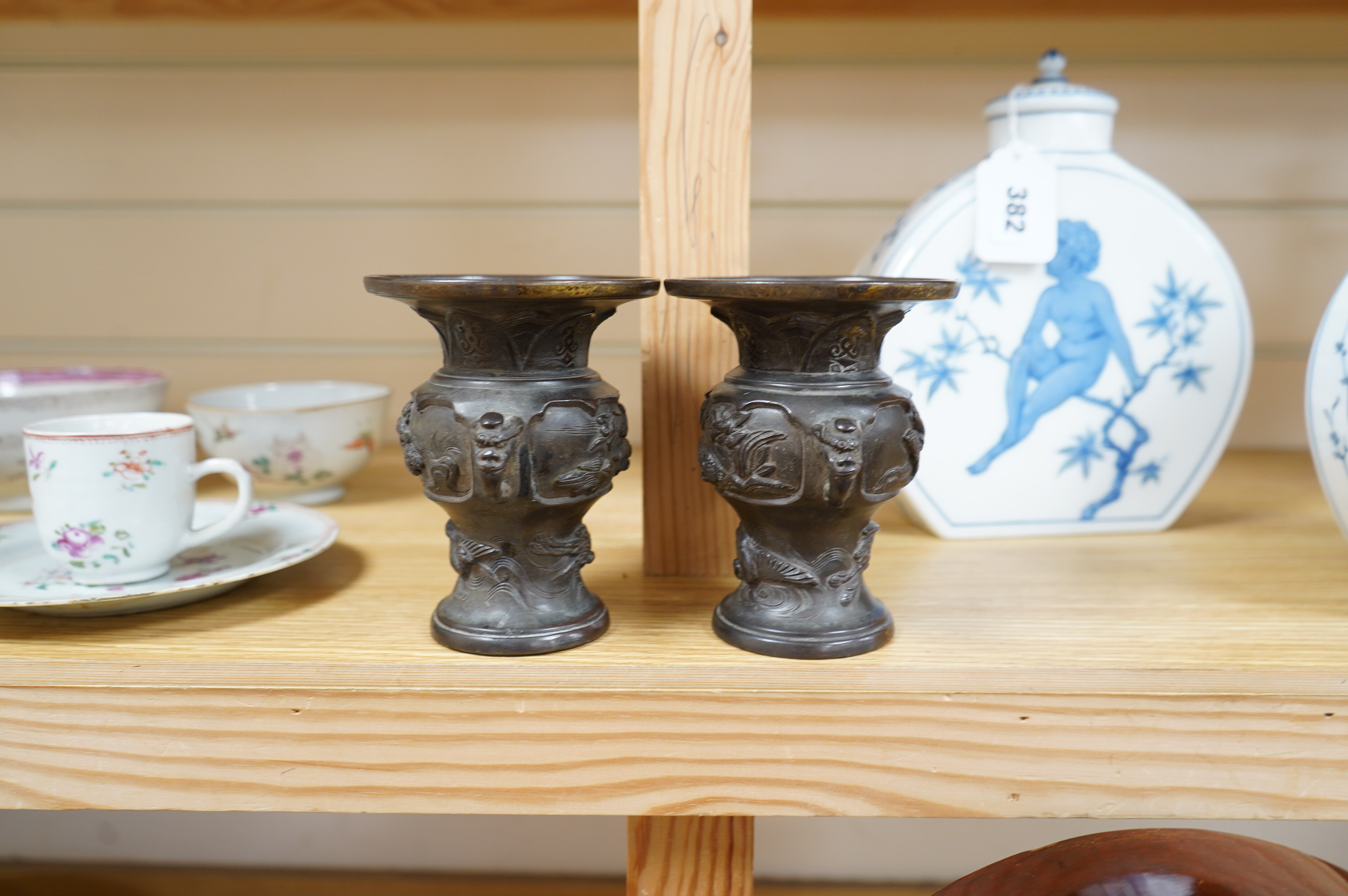 A pair of Japanese bronze vases, Meiji period, one signed, one lacking base, 13cm. Condition - fair